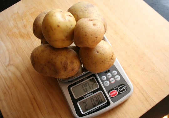 Weighing potatoes to get 2 lbs.