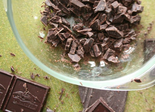 Chopped chocolate in a glass bowl