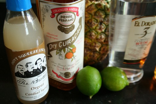 Mai Tai ingredients - orgeat syrup, Orange Curaçao, limes, rum